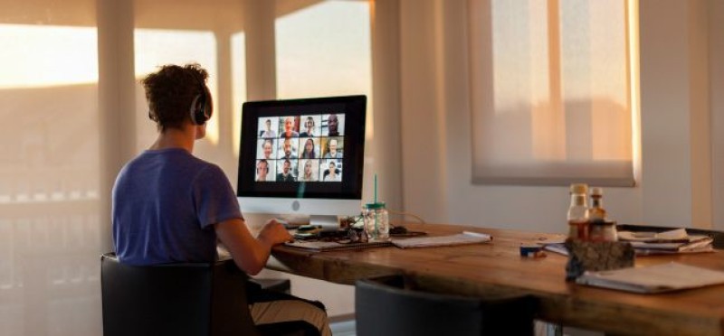 A man attending a zoom meeting